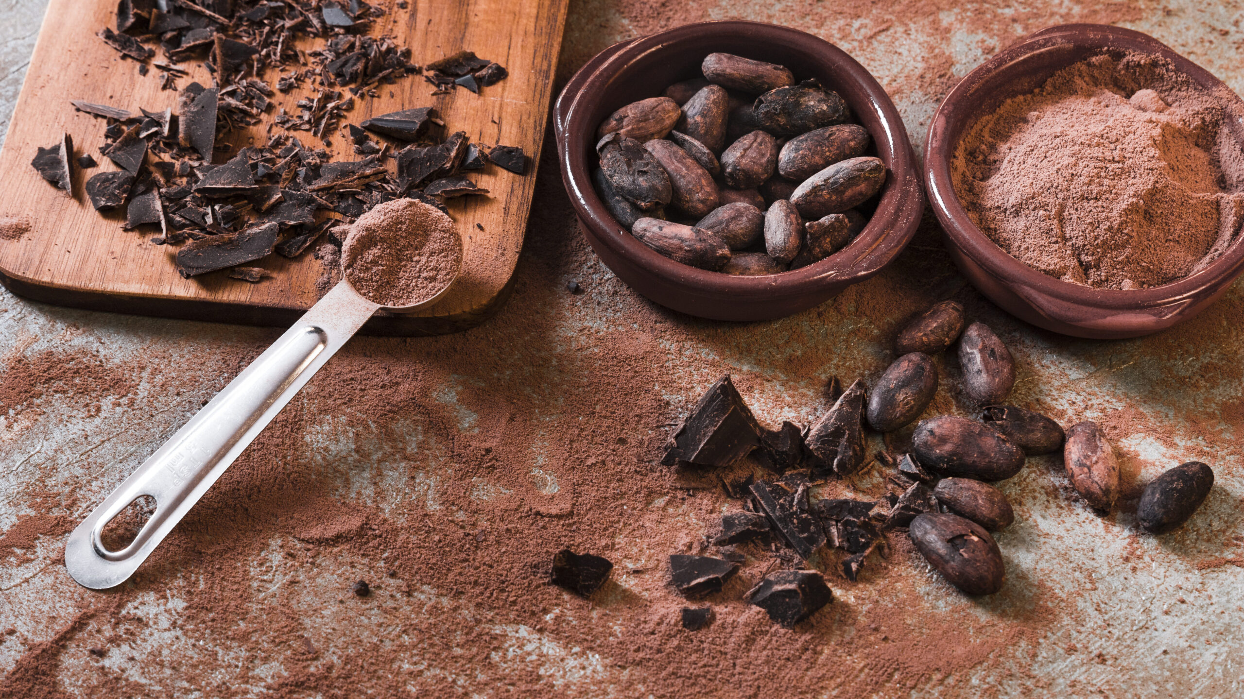 broken-chocolate-cocoa-beans-bowl-rustic-backdrop